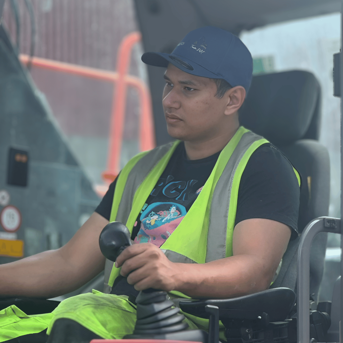 Machine operator at the controls of a material handler